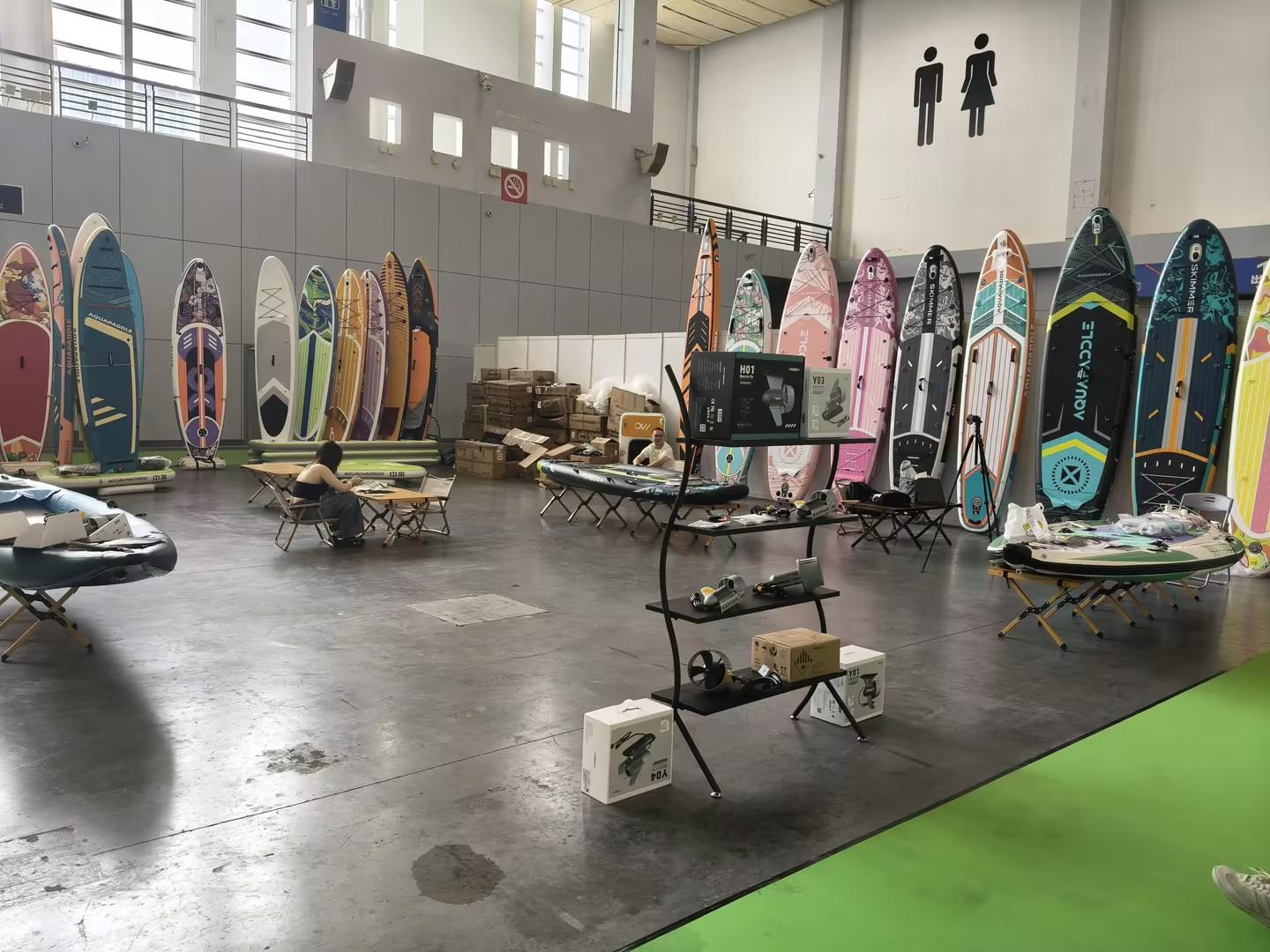 IFUNGOO H01, Y03 and D24 thrusters on display alongside partner SUP boards